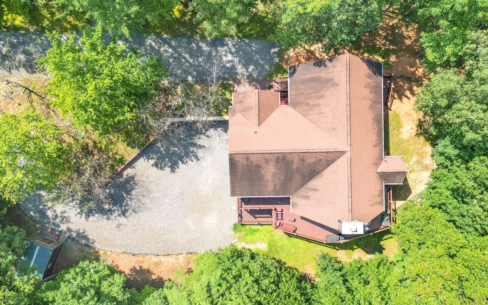 260 Berry Hl Road Murphy, NC 28906 - Photo 52 of 55 an aerial view of a house with a yard and large trees