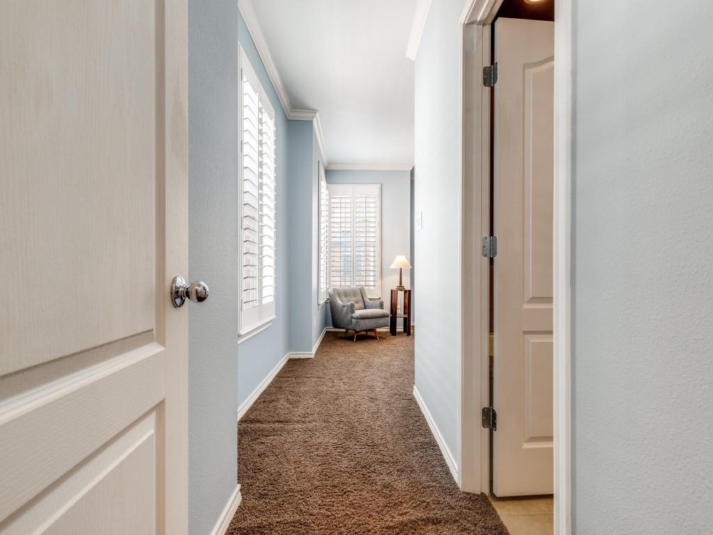 15741 Seabolt Place, Unit 28 Addison, TX 75001 - Photo 12 of 37 Hallway with dark colored carpet and ornamental molding
