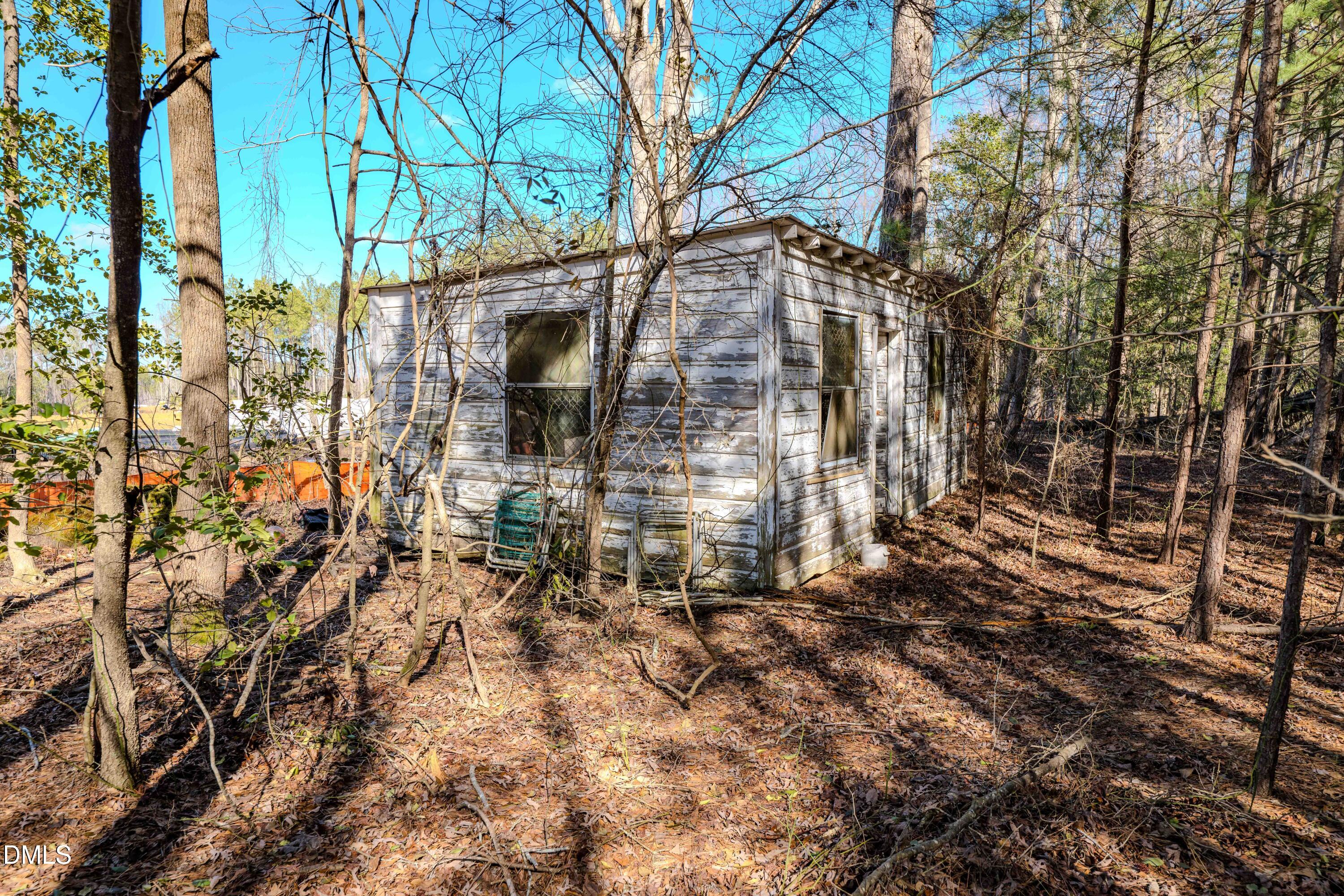 6724 Wimberly Road Willow Spring, NC 27592 - Photo 29 of 36 a view of a house with a tree