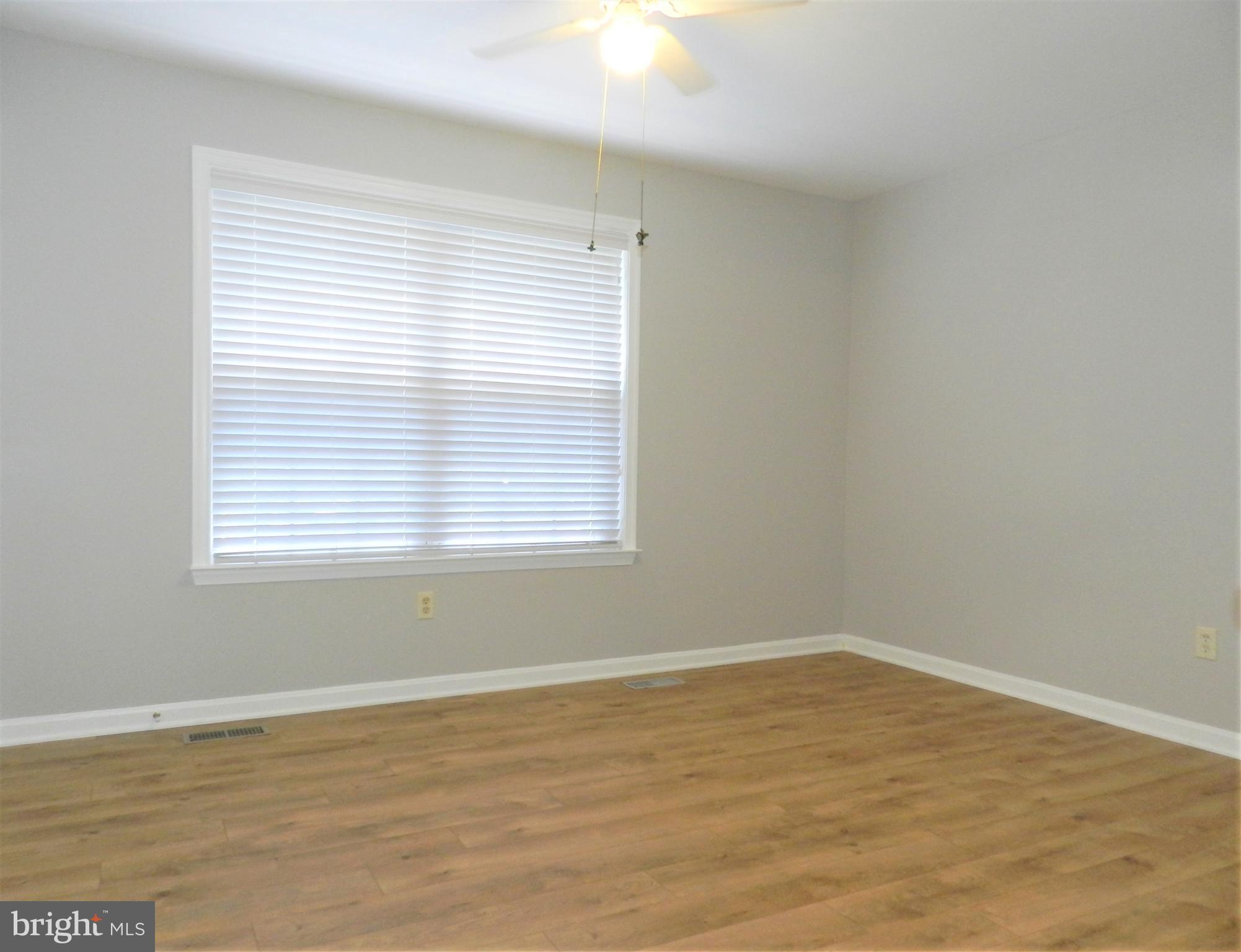 8650 Passapatanzy Road King George, VA 22485 - Photo 14 of 30 a view of a room with wooden floor and a window