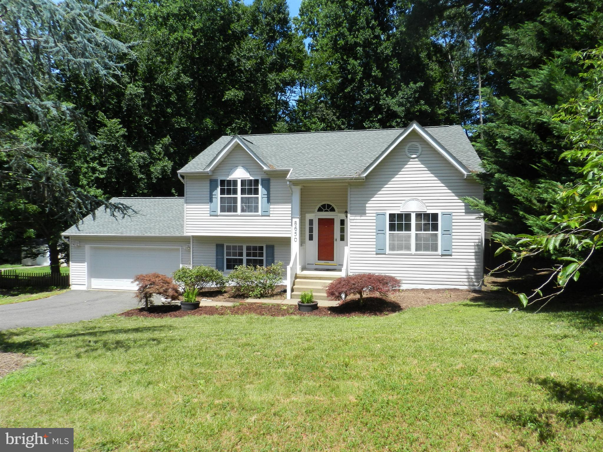 8650 Passapatanzy Road King George, VA 22485 - Photo 2 of 30 a front view of house with yard and green space