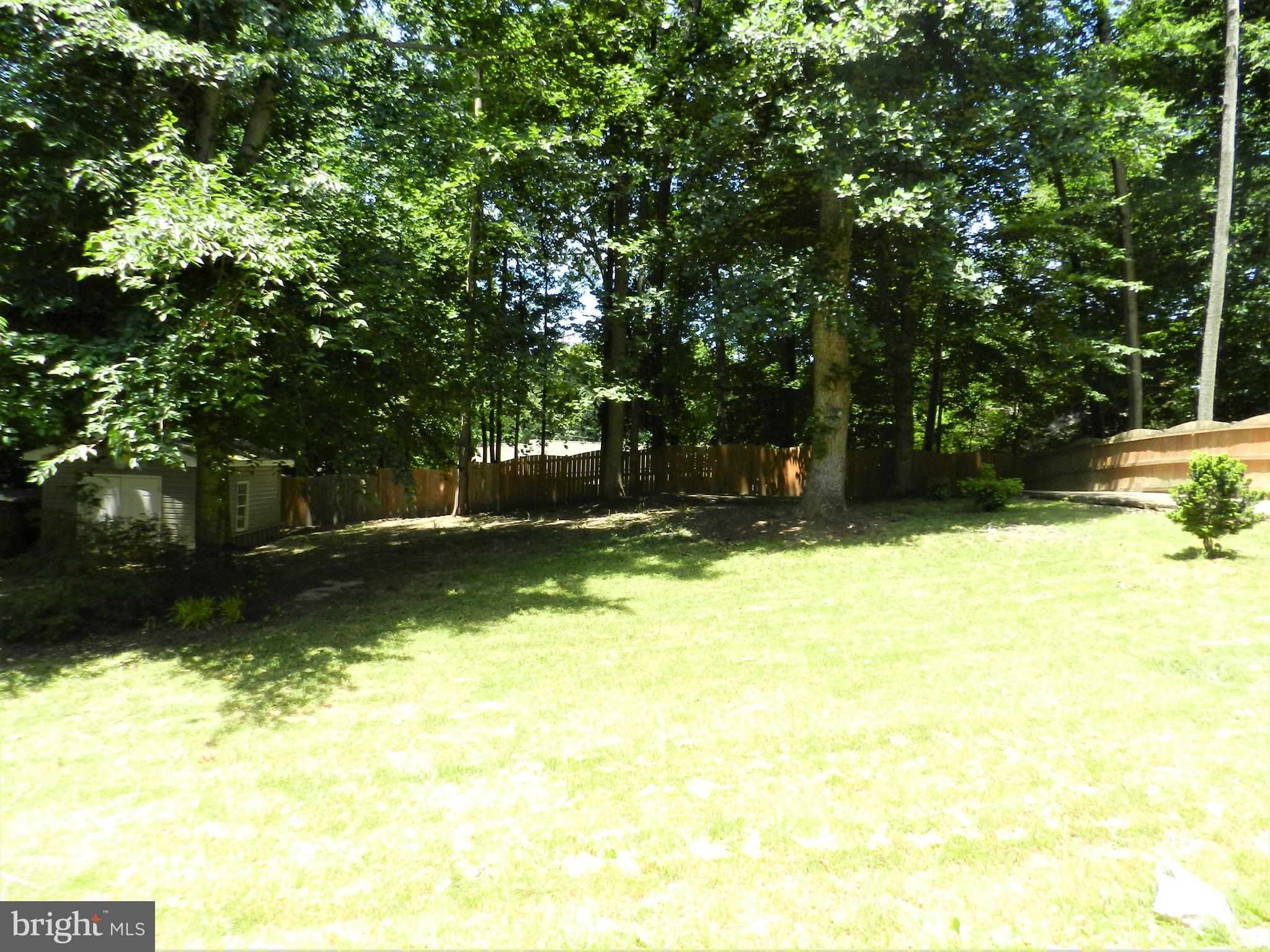 8650 Passapatanzy Road King George, VA 22485 - Photo 25 of 30 a view of swimming pool with a backyard