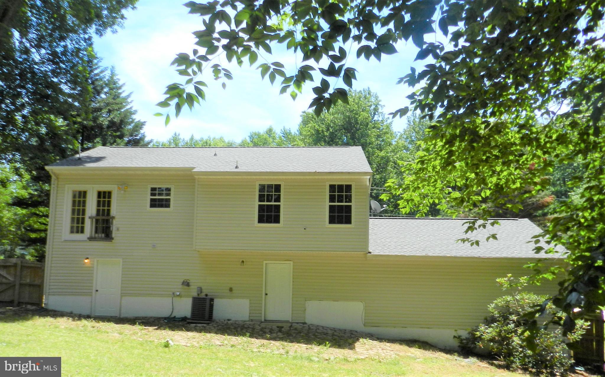 8650 Passapatanzy Road King George, VA 22485 - Photo 27 of 30 a view of a house with a backyard