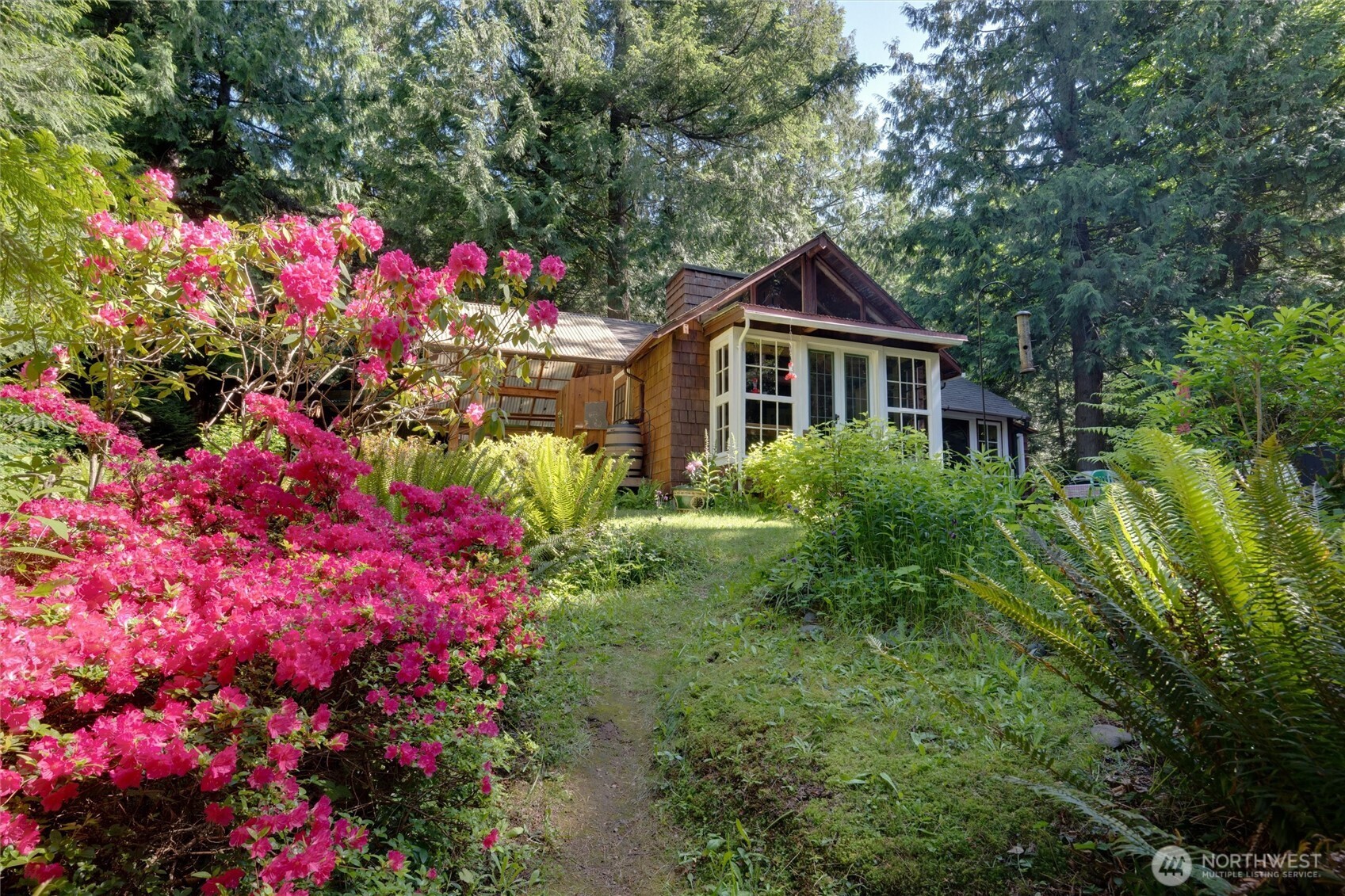 4315 Nordum Road Everson, WA 98247 - Photo 1 of 40 a view of a flower in a yard with potted plants