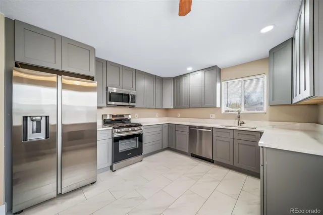 a kitchen with a refrigerator stove and microwave