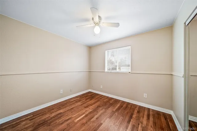 a bedroom with bed and window