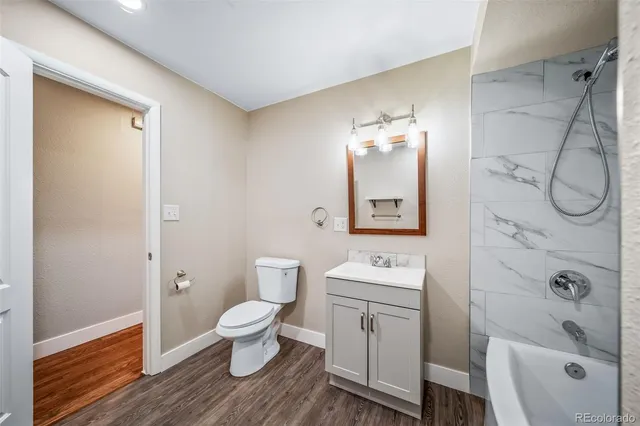 a bathroom with a bathtub and a sink