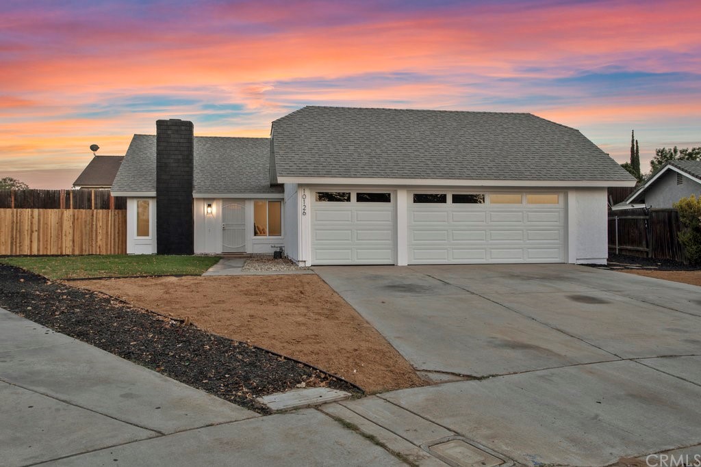 10126 Seneca Pass Riverside, CA 92503 - Photo 1 of 1 a front view of a house with a yard and garage
