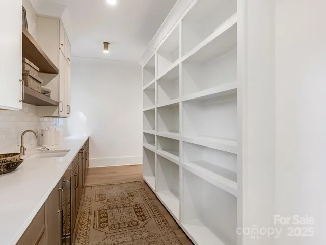 a kitchen with a sink and cabinets