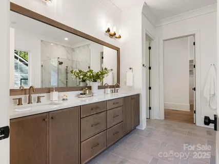 a white bath tub sitting next to a shower