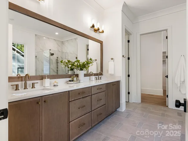 a white bath tub sitting next to a shower