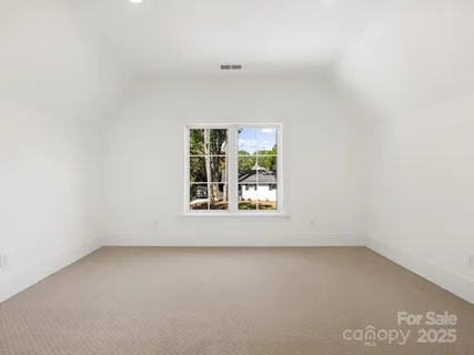 a kitchen with a sink a window and appliances