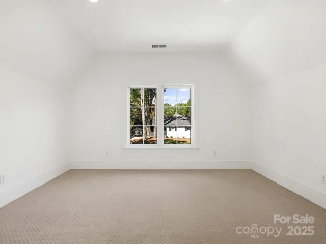 a kitchen with a sink a window and appliances