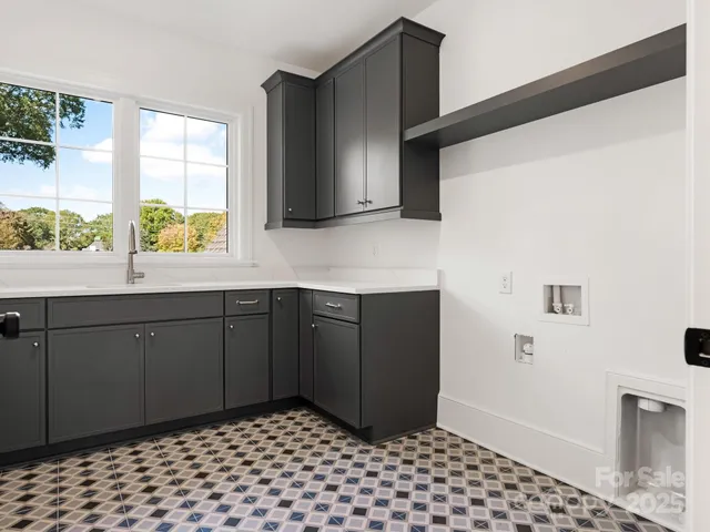 a kitchen with a sink and cabinets