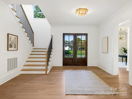 a view of entryway with stairs and a window