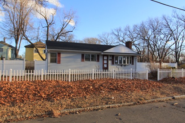 5 Oakhurst Street Springfield, MA 01104 - Photo 1 of 16 a front view of a house with a garden