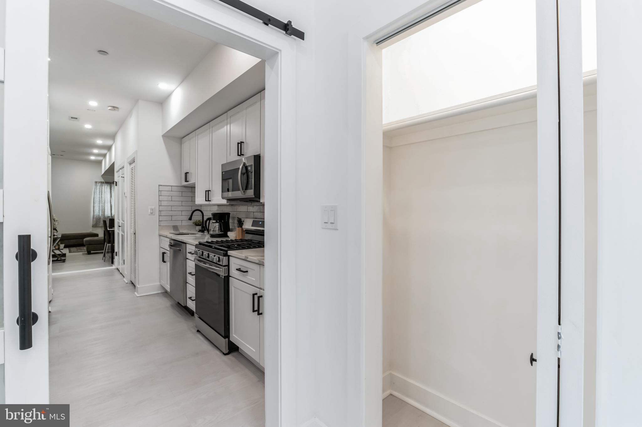 33 Florida Avenue Northeast, Unit 3 Washington, DC 20002 - Photo 4 of 9 a view of a kitchen with a refrigerator
