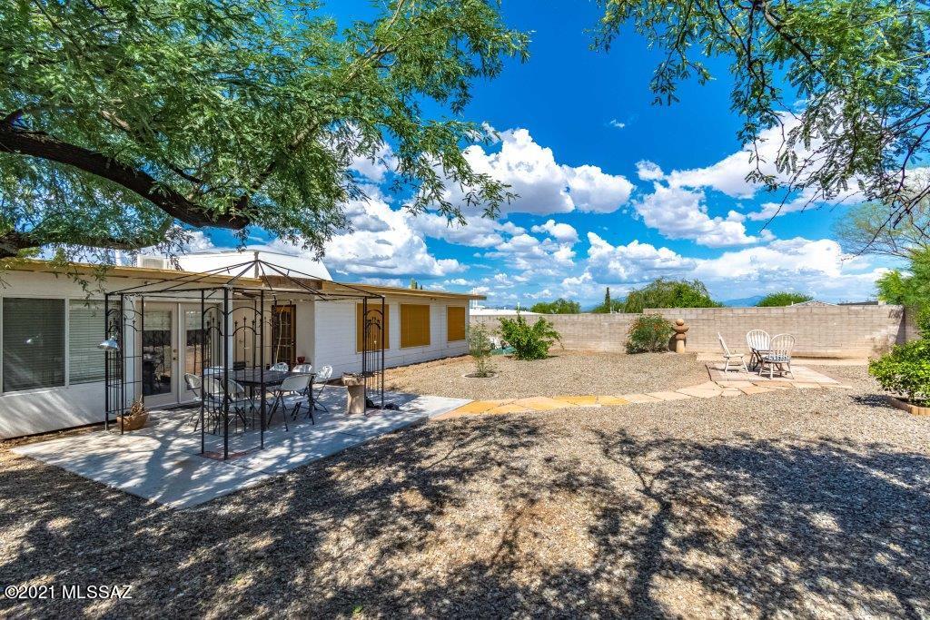 1901 West Romany Road Tucson, AZ 85713 - Photo 34 of 37 a front view of a house with a yard patio and fire pit