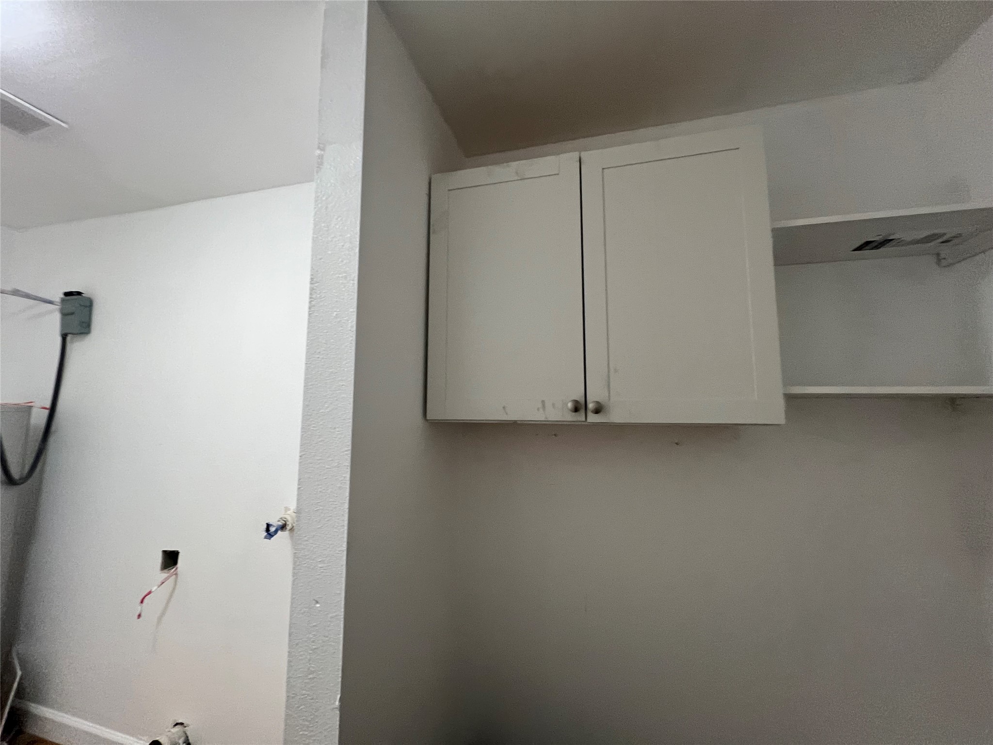 907 Daniel Street Cleveland, TX 77327 - Photo 26 of 45 Cabinet storage space in utility