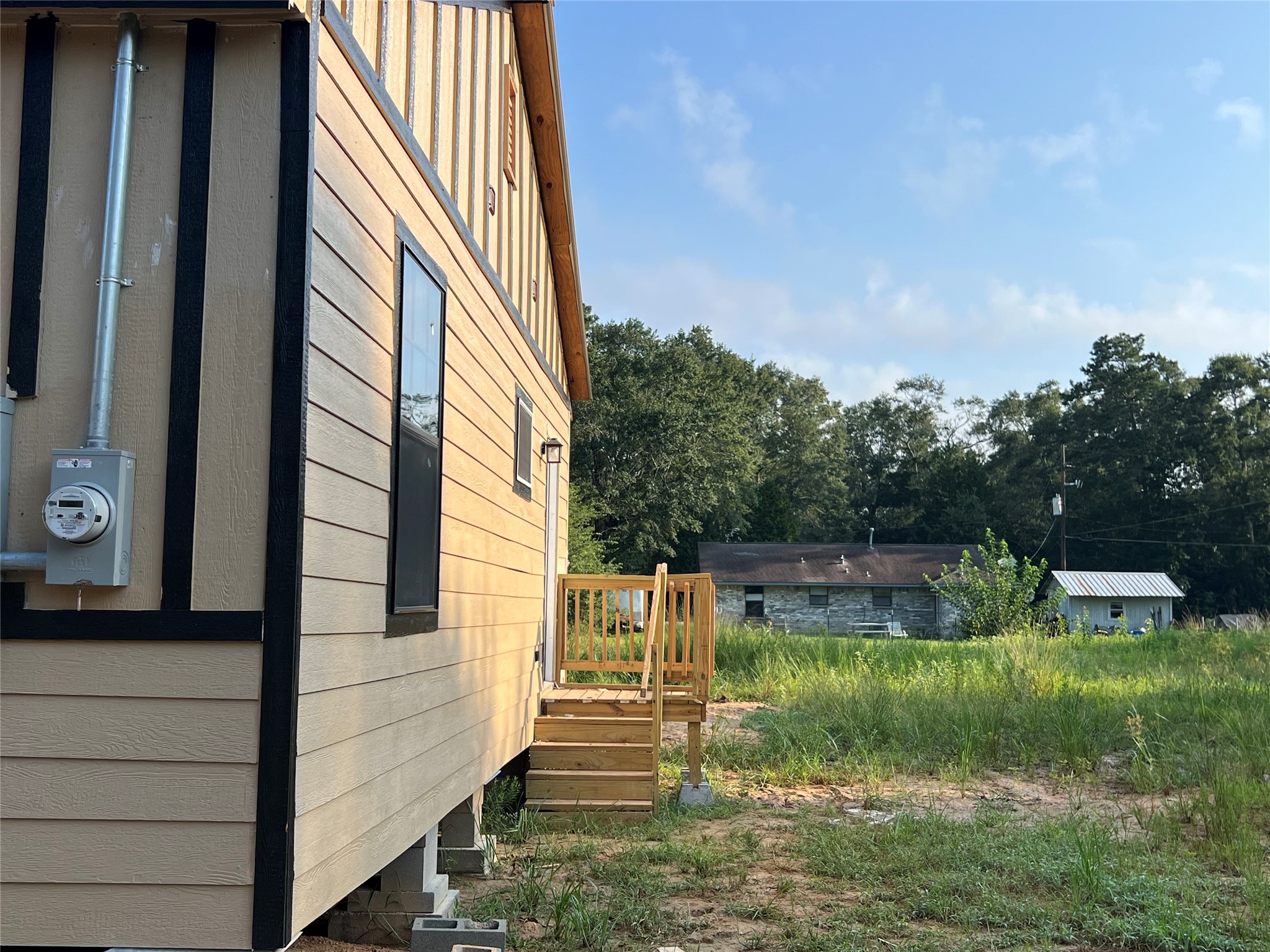 907 Daniel Street Cleveland, TX 77327 - Photo 9 of 45 Entrance on the Right side of the property to Utility