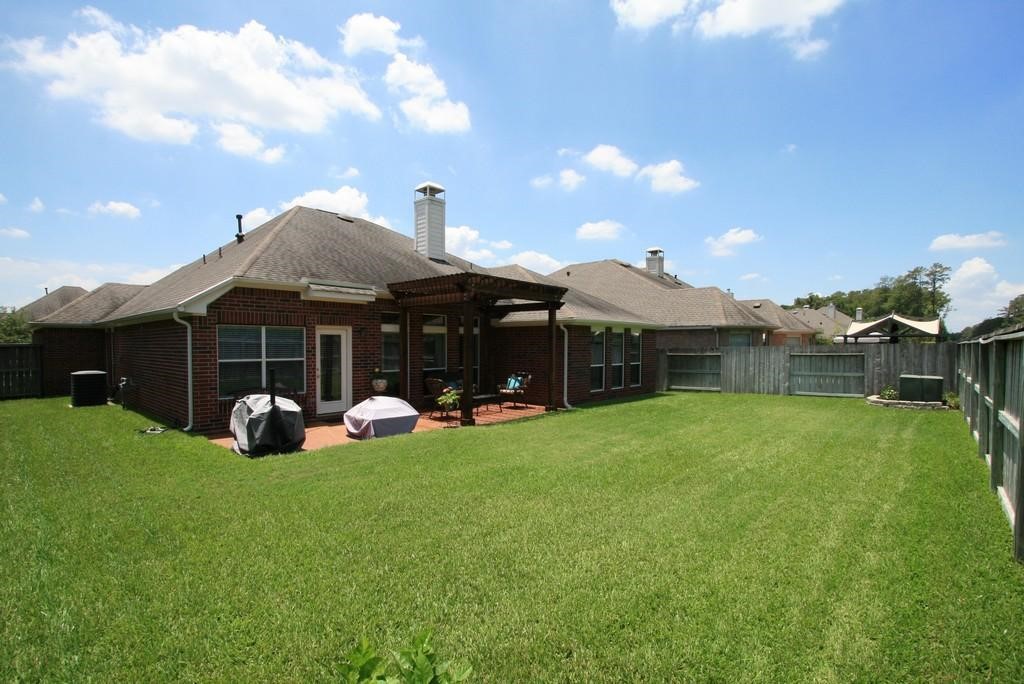 7423 Fall Springs Lane Humble, TX 77396 - Photo 4 of 6 a front view of a house with garden and porch