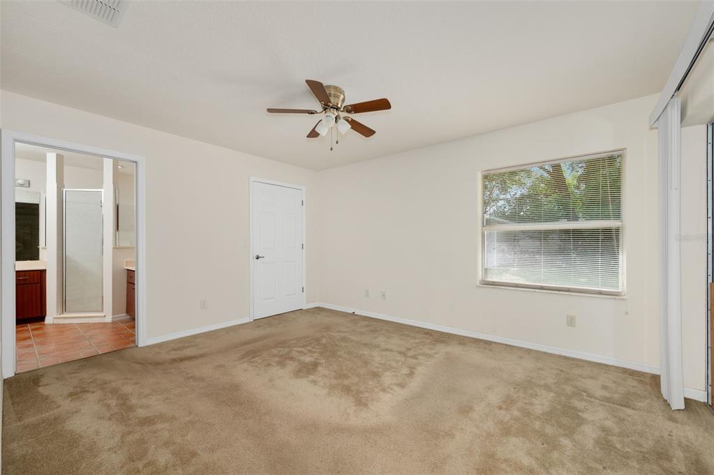5090 Southeast 28th Street Ocala, FL 34480 - Photo 15 of 35 an empty room with windows and closet