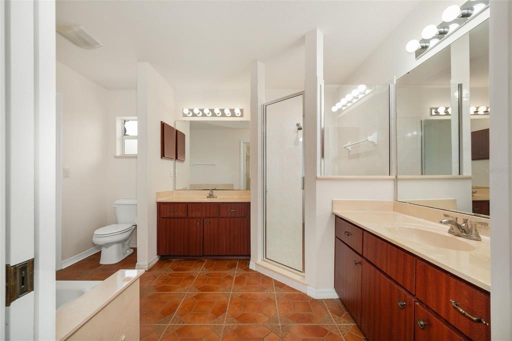 5090 Southeast 28th Street Ocala, FL 34480 - Photo 18 of 35 a bathroom with a sink a toilet and shower