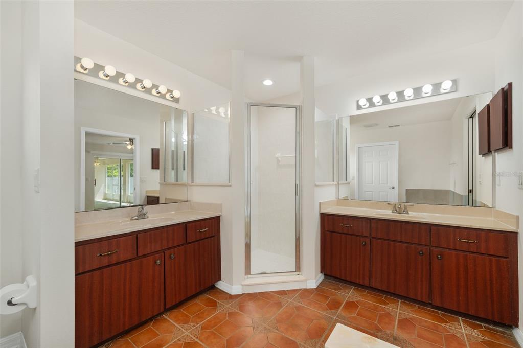 5090 Southeast 28th Street Ocala, FL 34480 - Photo 20 of 35 a spacious bathroom with a double vanity sink mirror and
