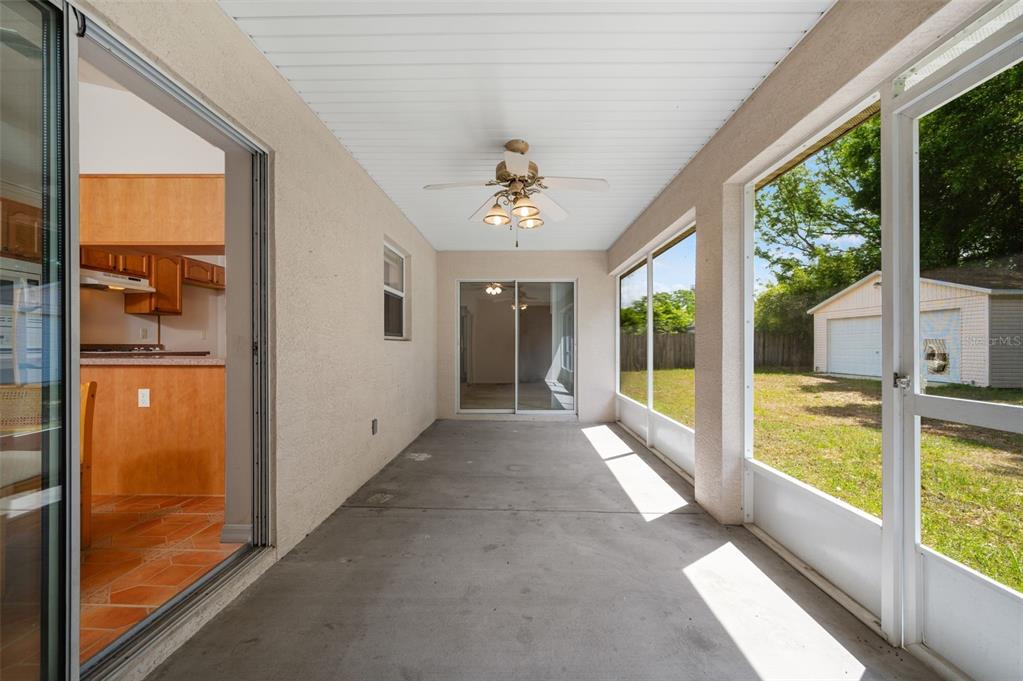 5090 Southeast 28th Street Ocala, FL 34480 - Photo 24 of 35 a view of a porch with a floor to ceiling window