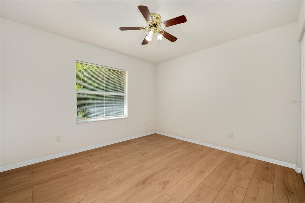 5090 Southeast 28th Street Ocala, FL 34480 - Photo 25 of 35 an empty room with a window and a fan
