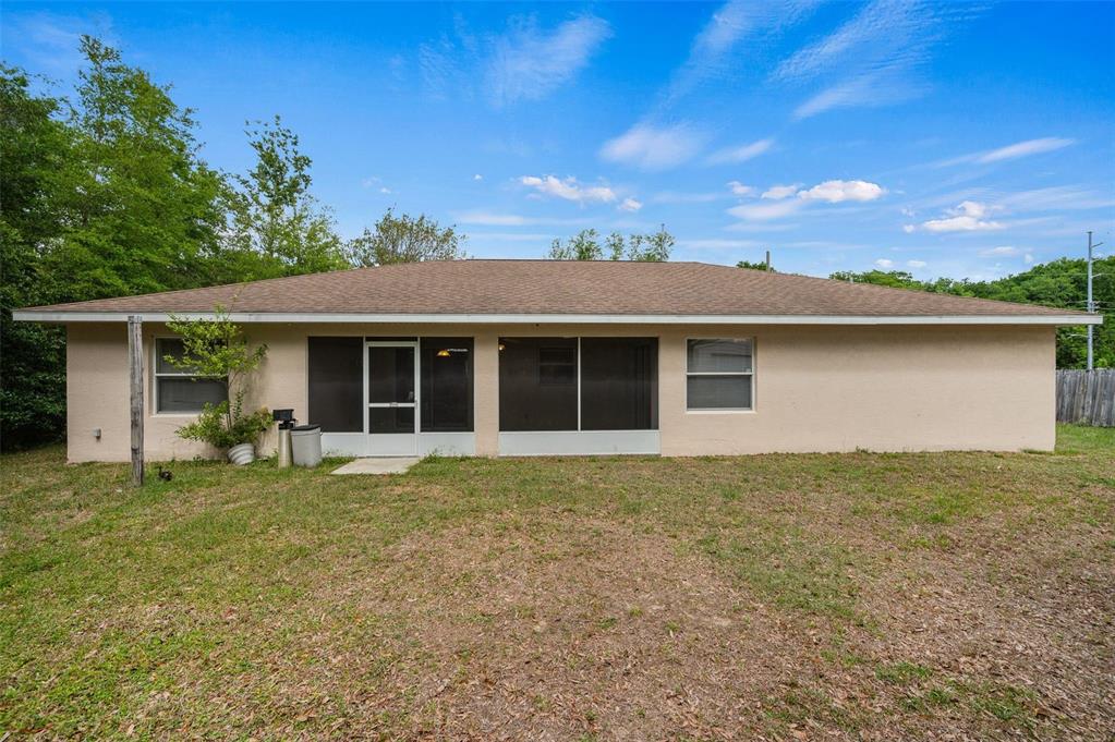 5090 Southeast 28th Street Ocala, FL 34480 - Photo 32 of 35 front view of a house with a garden