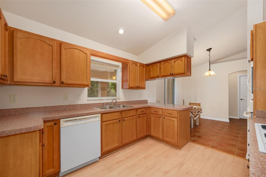 5090 Southeast 28th Street Ocala, FL 34480 - Photo 10 of 35 a kitchen with stainless steel appliances granite countertop a sink and cabinets