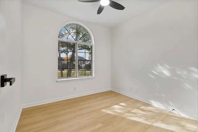 a view of an empty room with windows