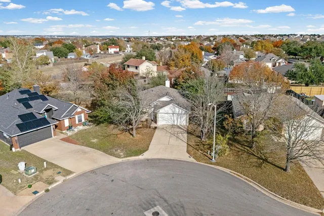 an aerial view of a house with a lake view