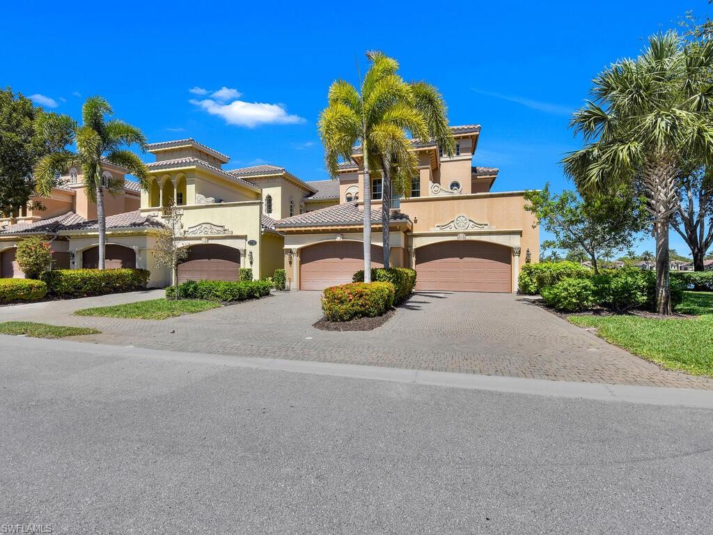 2710 Callista Court, Unit 104 Naples, FL 34114 - Photo 2 of 43 Mediterranean / spanish house featuring driveway, stucco siding, a tile roof, and an attached garage