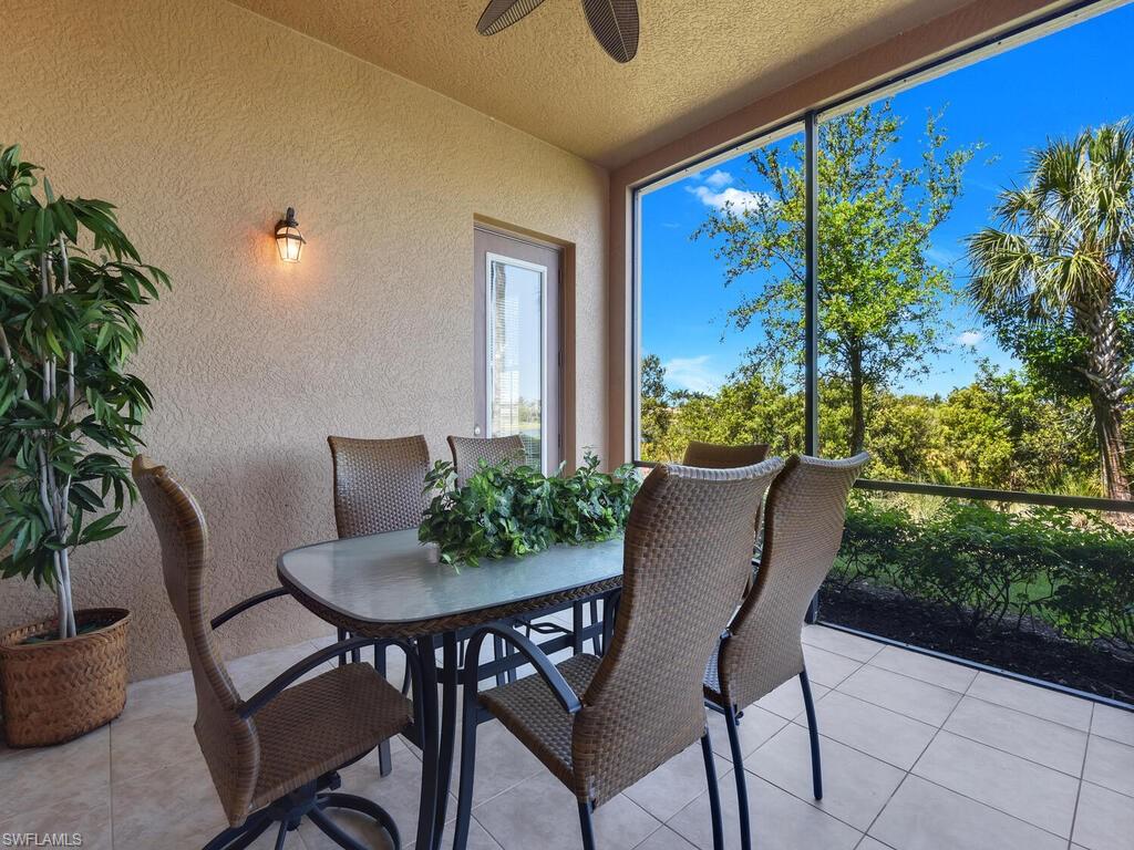 2710 Callista Court, Unit 104 Naples, FL 34114 - Photo 32 of 43 Sunroom with a textured ceiling, a textured wall, and tile patterned flooring