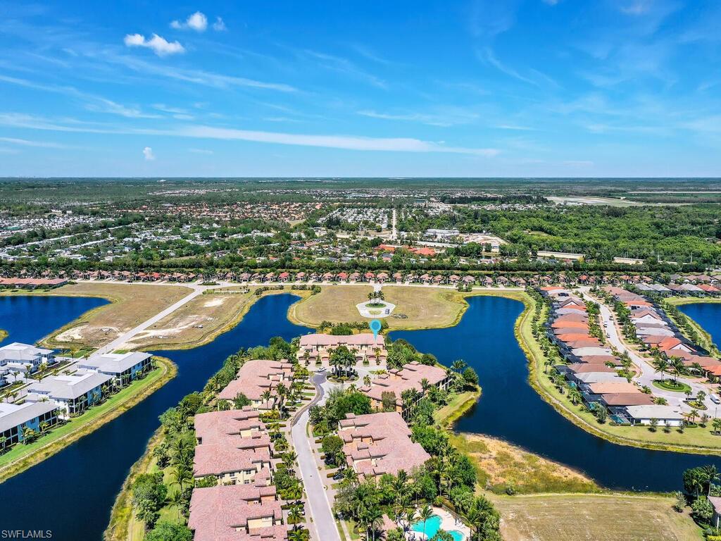 2710 Callista Court, Unit 104 Naples, FL 34114 - Photo 36 of 43 Aerial view featuring a water view