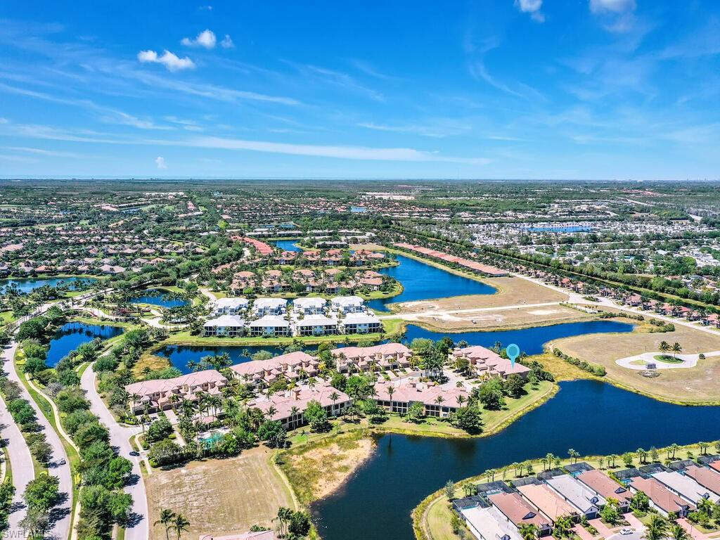 2710 Callista Court, Unit 104 Naples, FL 34114 - Photo 39 of 43 Drone / aerial view featuring a residential view and a water view