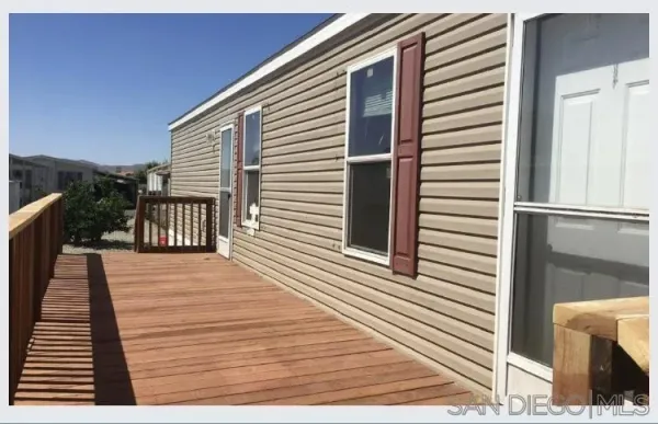 a view of a balcony with wooden floor