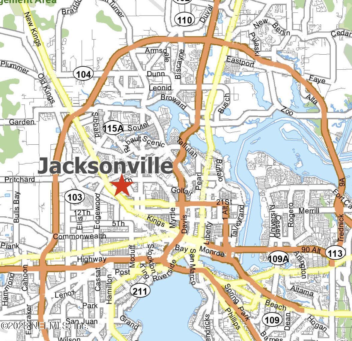 0 New Kings Road Jacksonville, FL 32209 - Photo 6 of 6 a picture of a building with a street sign and a tree