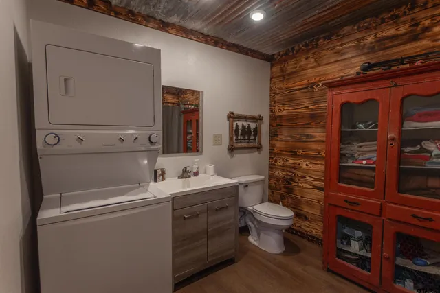 a bathroom with a toilet sink and mirror