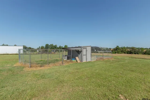 a view of a lake with houses in the background