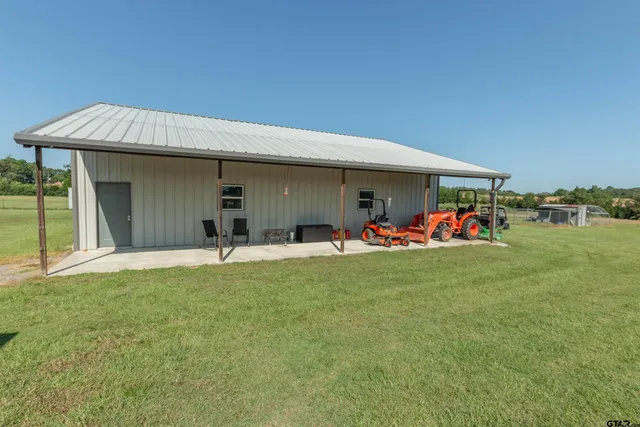 a front view of a house with a yard and a garage
