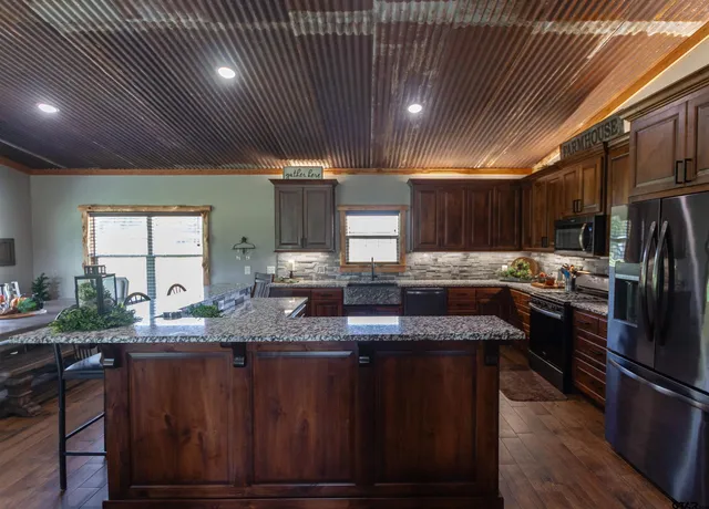 a kitchen with lots of counter space and a window