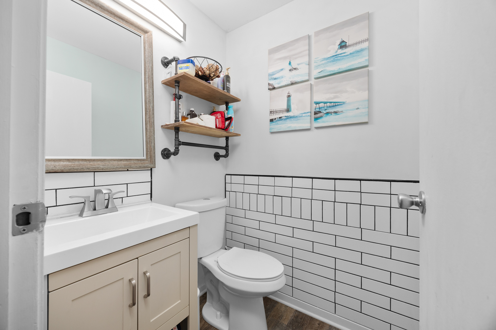 1100 Singleton Drive Roselle, IL 60172 - Photo 11 of 19 a bathroom with a toilet sink and mirror