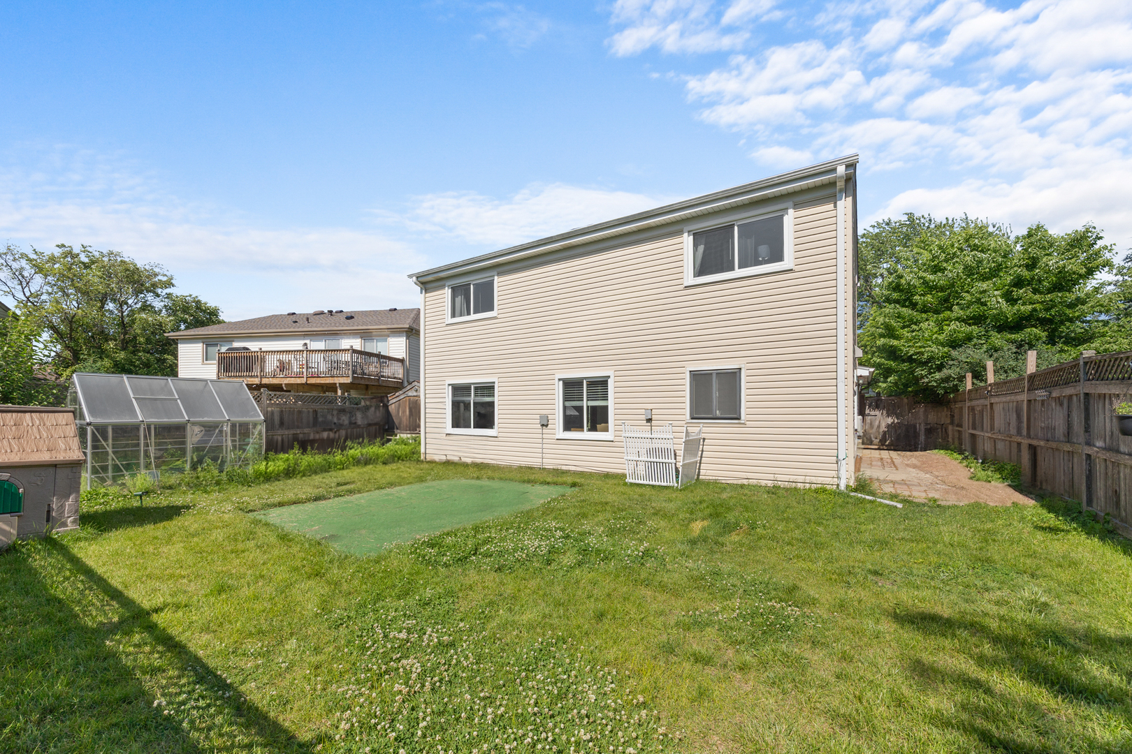 1100 Singleton Drive Roselle, IL 60172 - Photo 19 of 19 a view of a backyard with plants and a patio