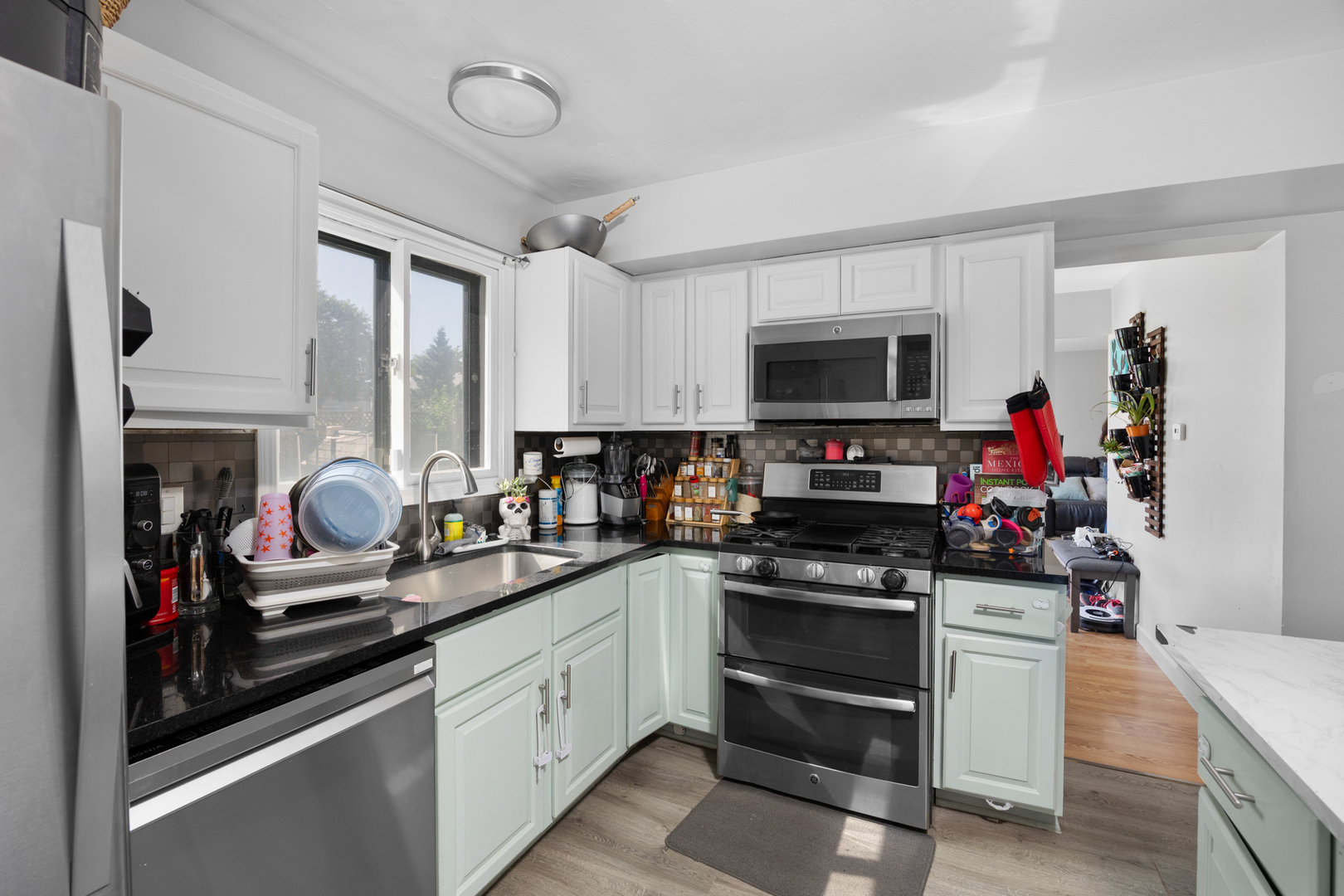 1100 Singleton Drive Roselle, IL 60172 - Photo 8 of 19 a kitchen with a sink appliances and cabinets