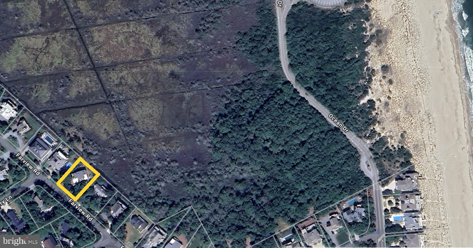 28 Farview Road Rehoboth Beach, DE 19971 - Photo 3 of 8 a view of a backyard with wooden fence