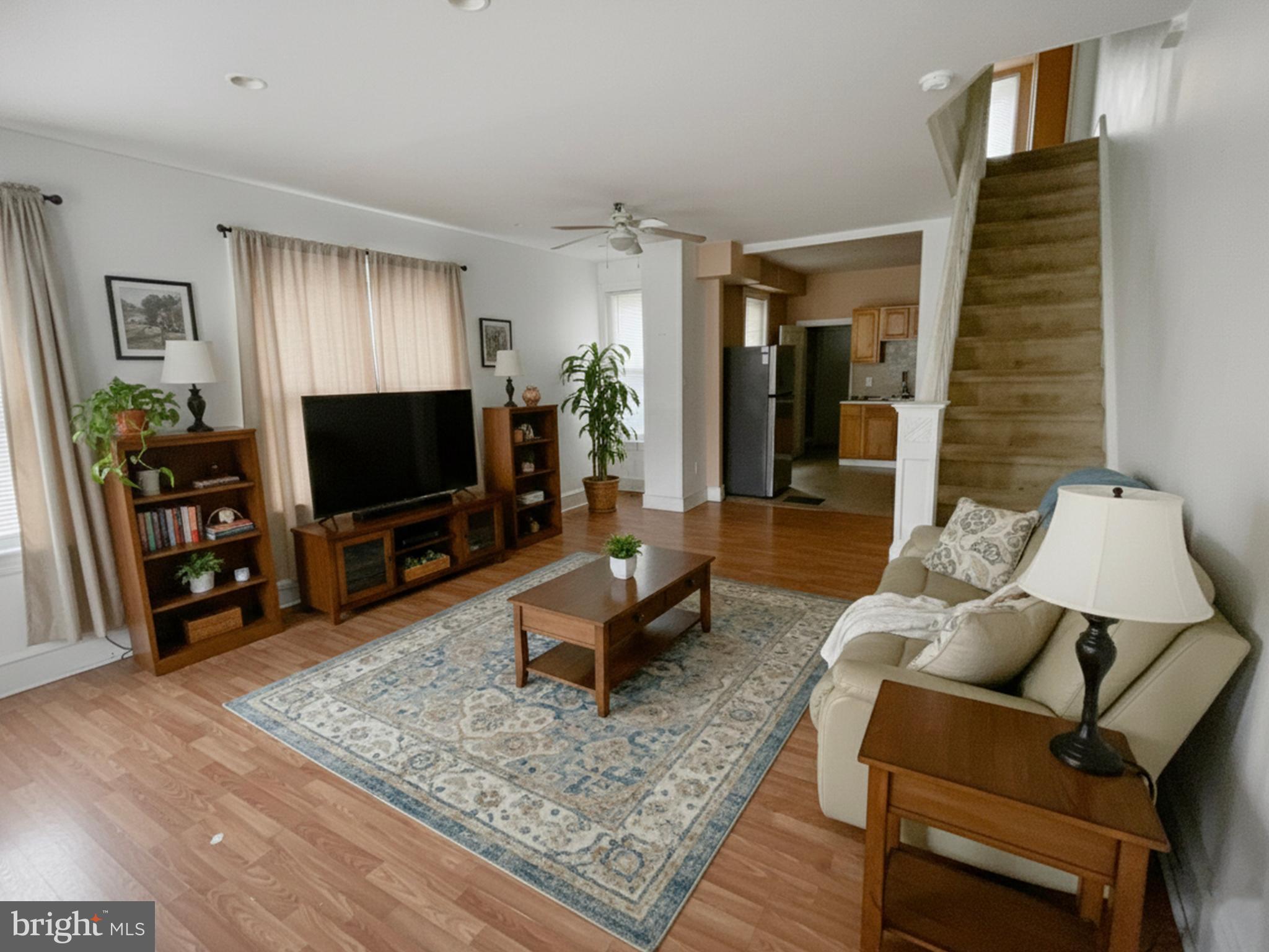 3936 North 8th Street Philadelphia, PA 19140 - Photo 2 of 10 a living room with furniture and a flat screen tv