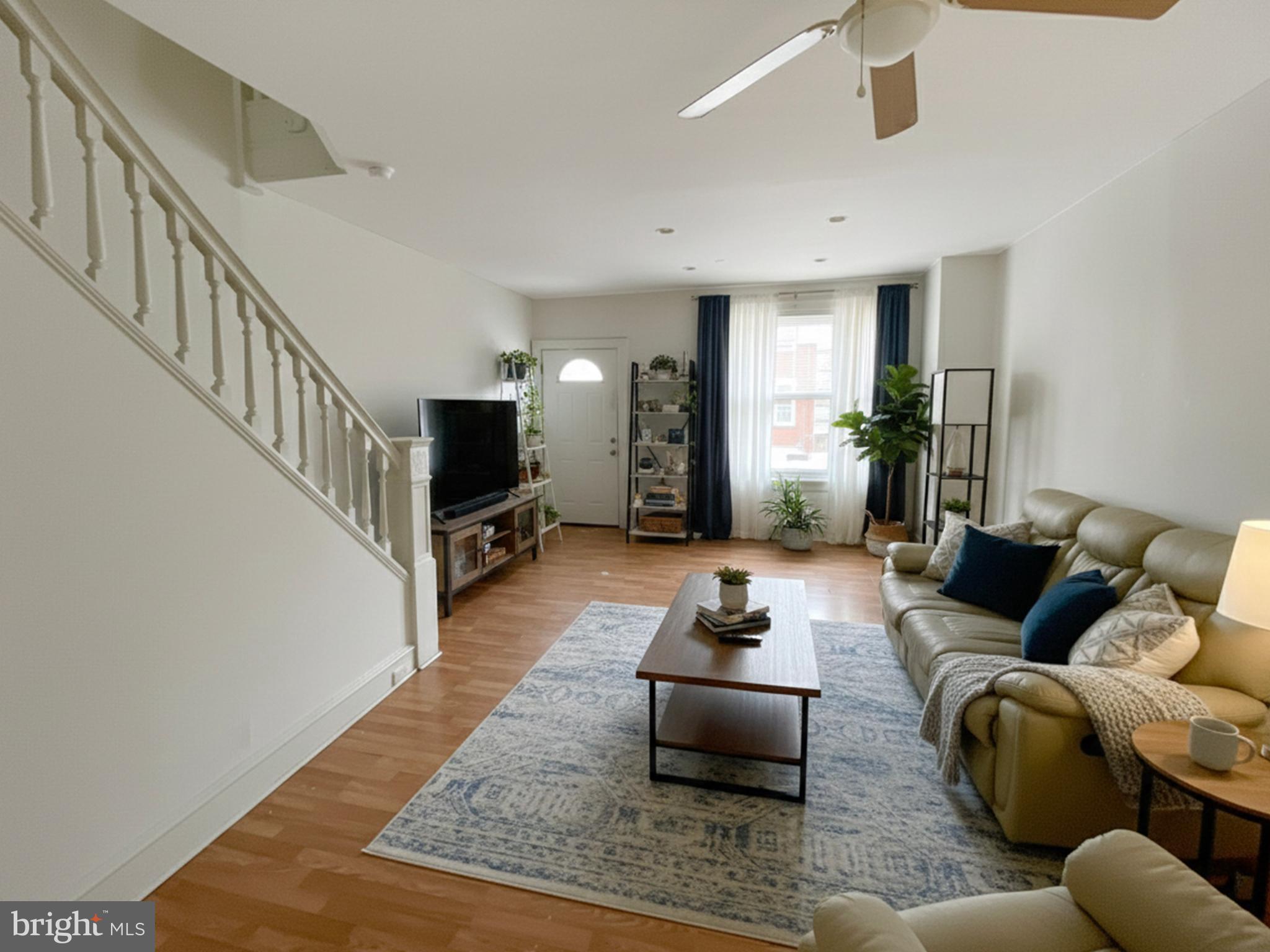 3936 North 8th Street Philadelphia, PA 19140 - Photo 3 of 10 a living room with furniture and a flat screen tv